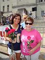 Barb receives her rose from a Rams cheerleader